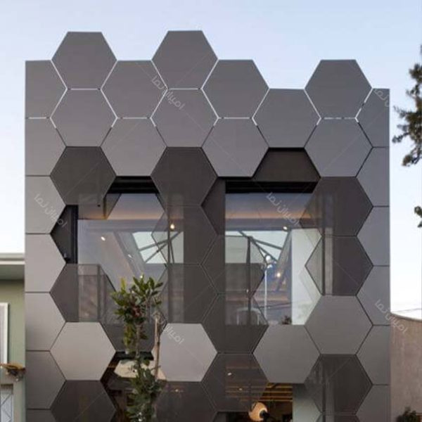 نمای فلزی مشبکی ساختمان به شکل کندو زنبور عسل با رنگ طوسی