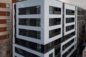 نمای ساختمان با آجرنمای طرح چرم رنگ سفید در ولنجک